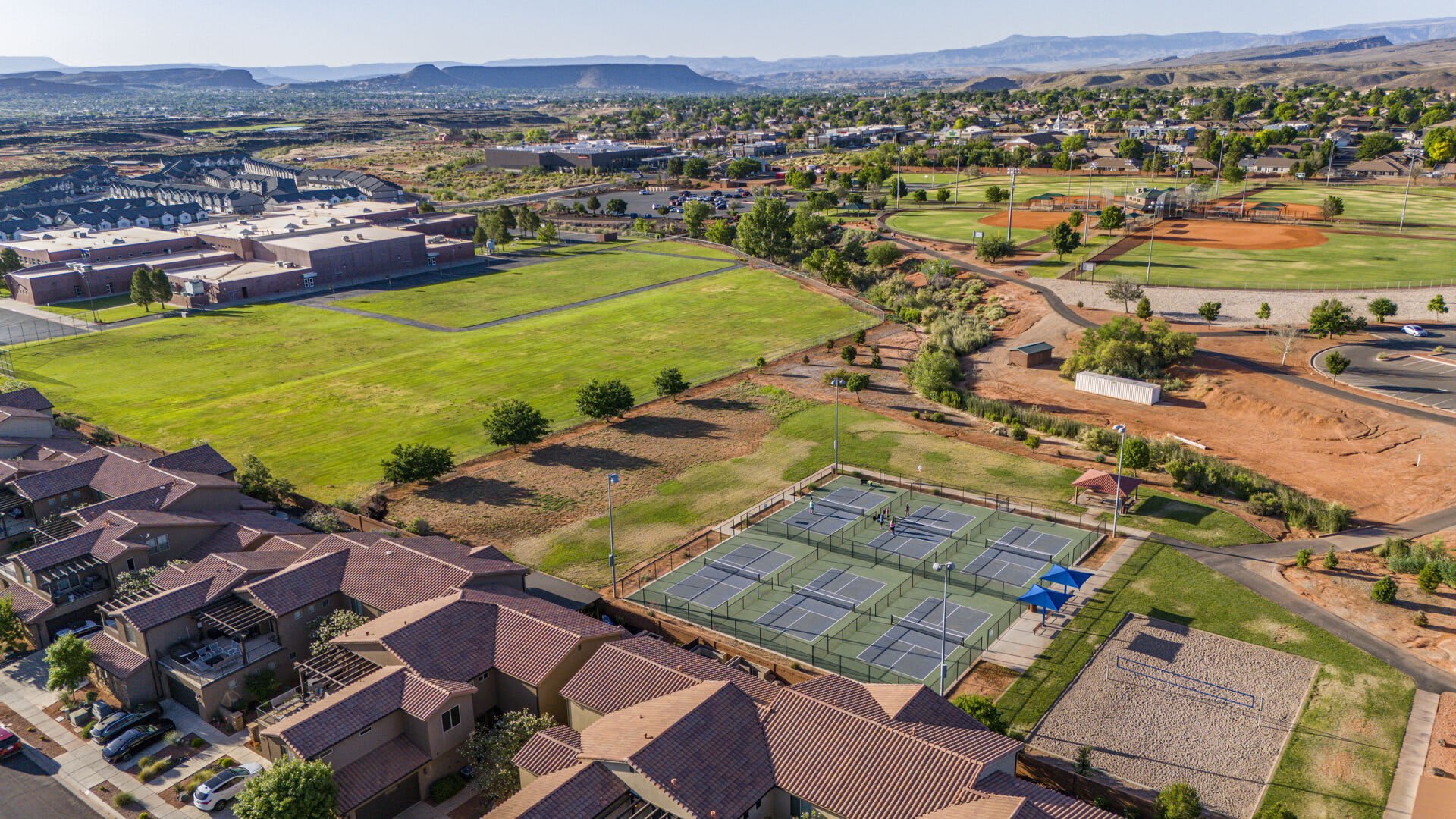 Aerial view of Paradise Village resort and pools near Sunshine Suites